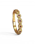Anillo cintillo rubís en oro 18K hecho a mano