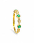 Anillo cintillo esmeraldas y diamantes en ojitos ruleteados