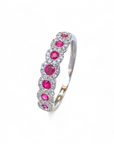 Anillo Cintillo Rubies en Halo de Brillantes