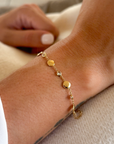 Pulsera bolitas planas y topacios oro 18K