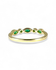 Anillo Cintillo Esmeralda ojitos y círculos en bisel de oro 10K