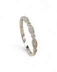 Anillo cintillo ojitos y brillante bisel oro blanco 14K