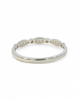 Anillo cintillo ojitos y brillante bisel oro blanco 14K