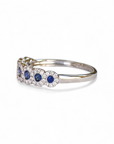A pedido - Anillo Cintillo de 7 Zafiros en Halo de Brillantes