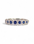 A pedido - Anillo Cintillo de 7 Zafiros en Halo de Brillantes
