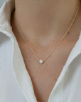 ClaraJoyas gold-plated sterling silver necklace with a bezel-set cubic zirconia pendant on a delicate chain.