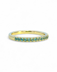 Anillo Cintillo Topacio Swiss Blue microgrifa en oro 10K