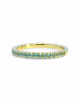 Anillo Cintillo Topacio Swiss Blue microgrifa en oro 10K