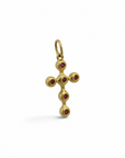 Cruz Sophia Schneider Joyas de oro 18K con seis rubíes engastados en bisel, diseño artesanal de 36x18 mm.
