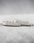 Aros argollas ovales curvas diamantes baguette en riel 0,25 ct plata 925