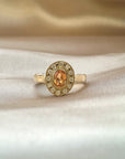 Anillo solitario turmalina dorada oval halo brillantes 18K