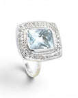 Anillo solitario topacio rectangular bisel halo brillantes platino