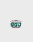 Anillo Tricillo Esmeralda Oval 1,8 Ct con halo de diamantes
