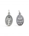 Sophia Schneider Joyas oval silver medal featuring Virgin Mary on one side and Sacred Heart with M emblem on the other.