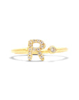 Anillo abierto Sophia Schneider Joyas de oro 18K con letra R decorada con brillantes y un diamante en bisel.