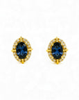 Aros stud Sophia Schneider Joyas de oro 10K con zafiro ovalado central y halo de brillantes