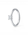 Sophia Schneider Joyas 10K white gold ring with a 0.16 ct princess-cut diamond solitaire.