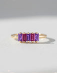 Sophia Schneider Joyas 14K gold ring with five baguette-cut amethyst and rhodolite stones in alternating purple and pink hues.