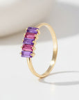 Sophia Schneider Joyas 14K gold ring with alternating purple amethyst and pink rhodolite baguette-cut stones.