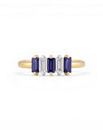 Sophia Schneider Joyas 14K gold ring with alternating Iolita and zircon baguette-cut stones.