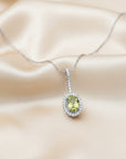 Sophia Schneider Joyas 14K white gold pendant necklace with oval peridot and diamond halo
