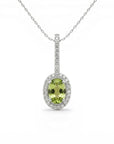 Sophia Schneider Joyas 14K white gold oval peridot pendant necklace with diamond halo