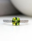 Sophia Schneider Joyas 14K gold ring with cushion-cut peridot and 0.62 ct diamonds on band.