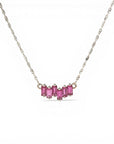 Sophia Schneider Joyas 14K gold necklace with a curved row of 5 baguette-cut rhodolite stones.