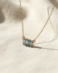 Sophia Schneider Joyas 14K gold necklace with baguette-cut blue topaz and clear cubic zirconia.