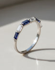 Sophia Schneider Joyas 14K white gold ring with alternating baguette-cut iolite and zircon stones.
