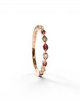 Sophia Schneider Joyas 14K rose gold ring with alternating marquise-cut rubies and round diamonds.