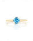 Sophia Schneider Joyas 18K yellow gold ring with a round 0.96 ct blue topaz gemstone.