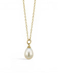 Sophia Schneider Joyas 18K gold necklace with a single oval pearl pendant on a delicate chain.