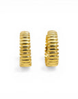 Sophia Schneider Joyas 18K gold textured wavy hoop earrings, 15mm diameter, sophisticated everyday wear.