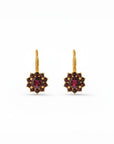 Sophia Schneider Joyas 14K gold dangle earrings with a central round garnet surrounded by ten smaller garnets in a floral halo design.