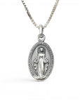 Sophia Schneider Joyas oval 16mm sterling silver medal of the Virgin of the Rays and Sacred Heart, with inscription.