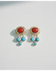Sophia Schneider Joyas silver earrings with oval red chalcedony and dangling turquoise stones.
