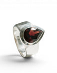 Sophia Schneider Joyas silver ring with a 6.53 ct pear-cut garnet gemstone.