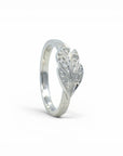 Sophia Schneider Joyas silver ring with carved leaf design and cubic zirconia stones.