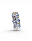 Sophia Schneider Joyas sterling silver ring with three oval blue tanzanite and topaz stones.