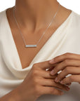Sophia Schneider Joyas 10K white gold bar necklace with baguette and brilliant cut lab diamonds.