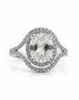 Sophia Schneider Joyas oval white quartz and topaz ring with diamond halo and silver band.