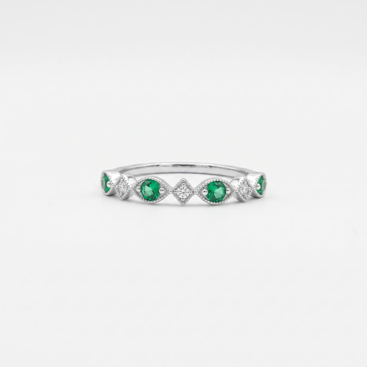 Anillo cintillo diamantes y esmeralda plata