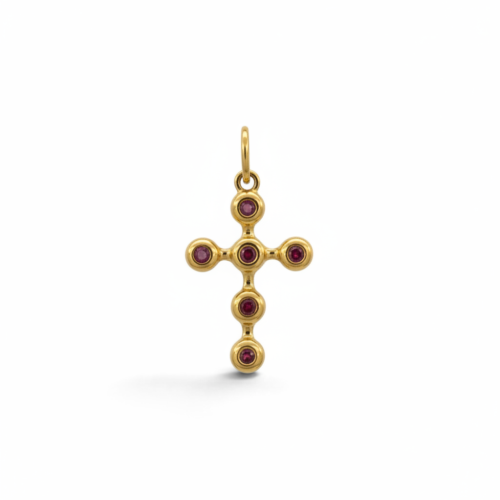 Colgante cruz Sophia Schneider Joyas de oro 18K con seis rubíes engastados en bisel, diseño artesanal chileno.
