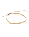Pulsera ajustable ClaraJoyas de hilo beige con mostacillas planas de plata bañadas en oro brillante