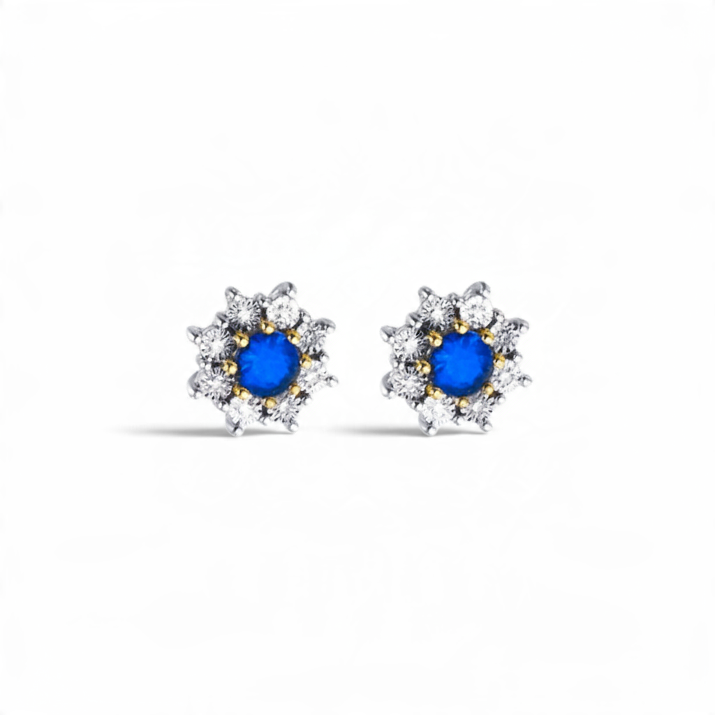 Aros stud Sophia Schneider Joyas de oro amarillo 18K con zafiro central y halo de diamantes brillantes