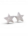 Aros stud estrellas diamantes pavé 0,14 ct plata 925
