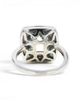Anillo solitario topacio rectangular bisel halo brillantes platino