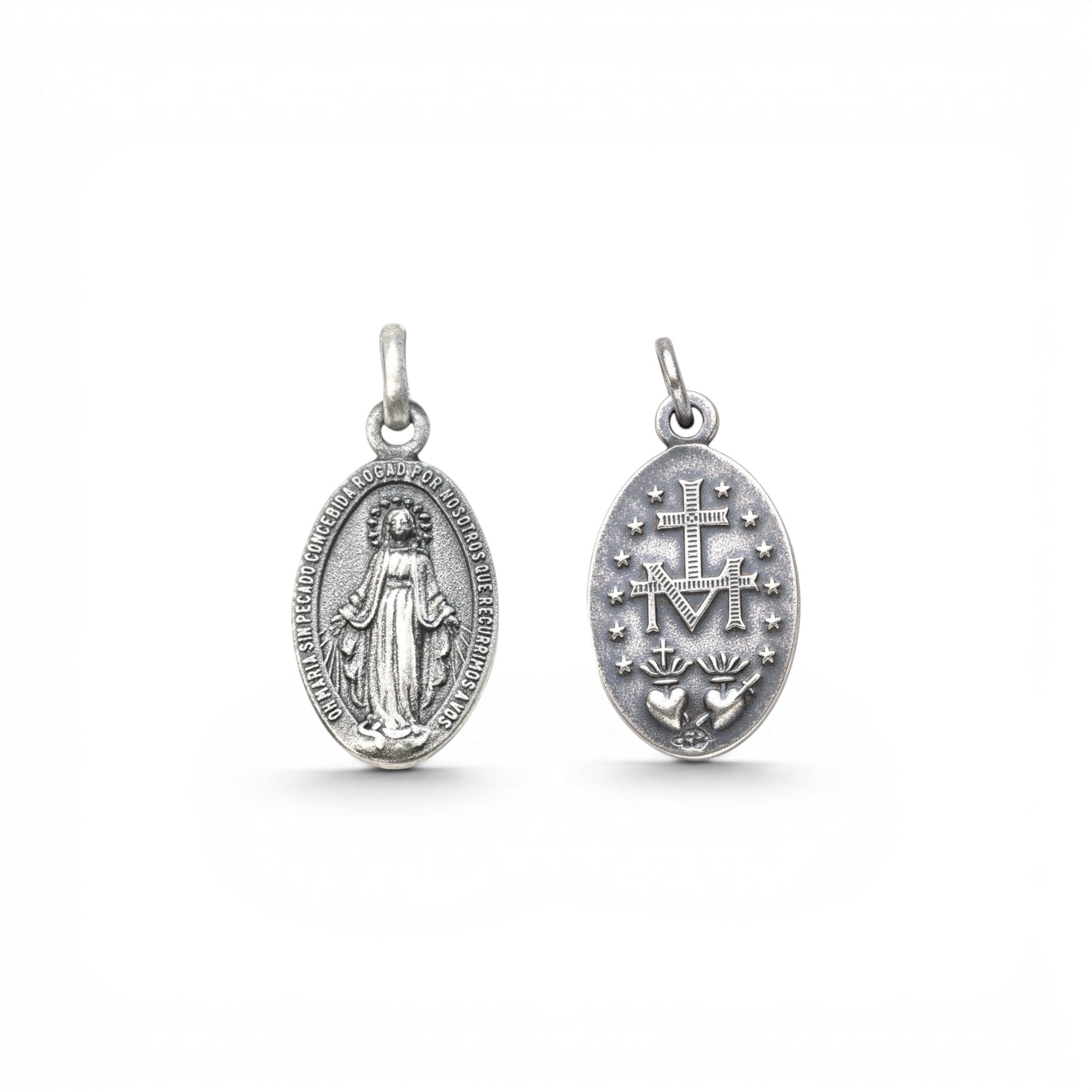 Sophia Schneider Joyas oval silver medal featuring Virgin Mary on one side and Sacred Heart with M emblem on the other.