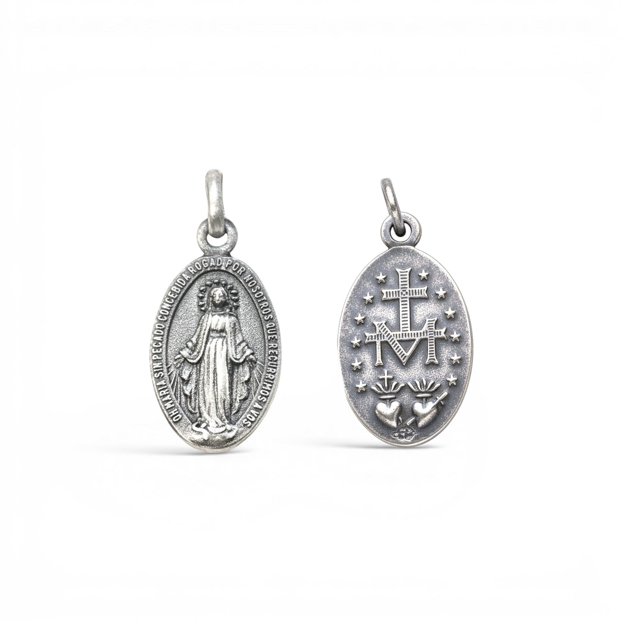 Sophia Schneider Joyas oval silver medal featuring Virgin Mary on one side and Sacred Heart with M emblem on the other.